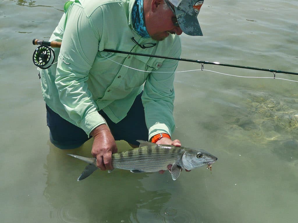 Angler with an 8-weight fly rod