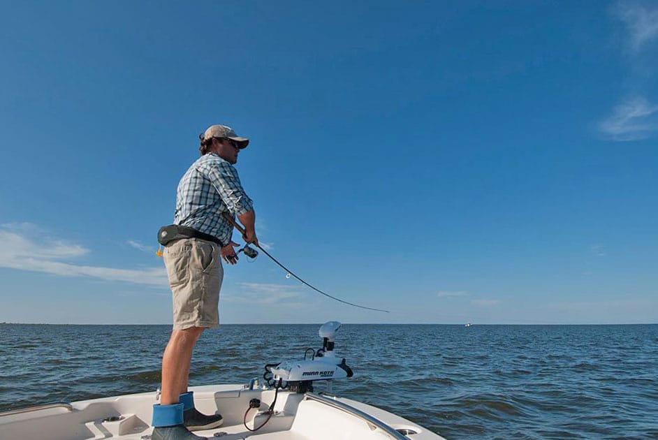 Angler popping a spinning fishing reel