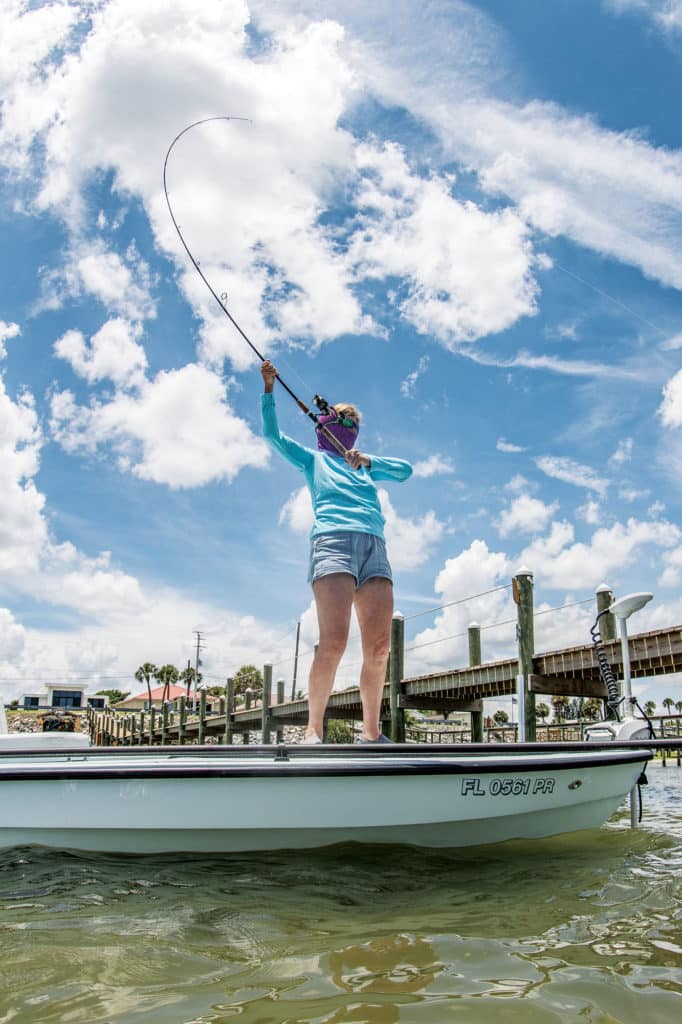 Pulling in a large fish near the boat